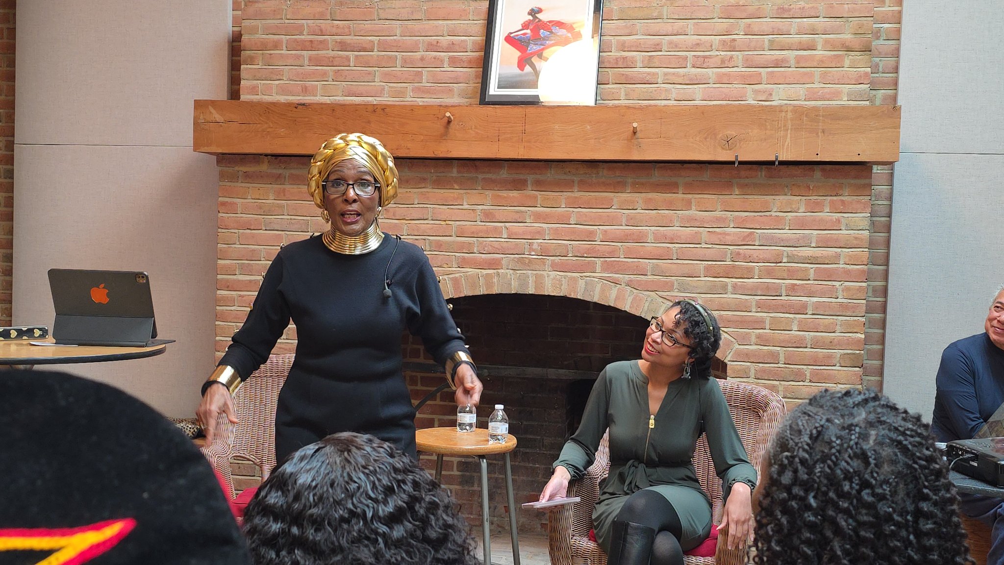 Dr. Barbara Talley speaking with Radiance Talley seated beside her